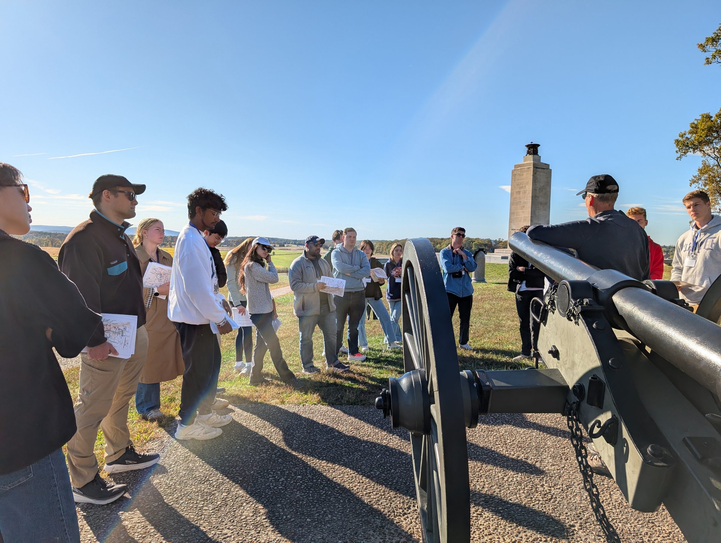 Kevin Weddle addressing a group beside a Civil War cannon at Gettysburg