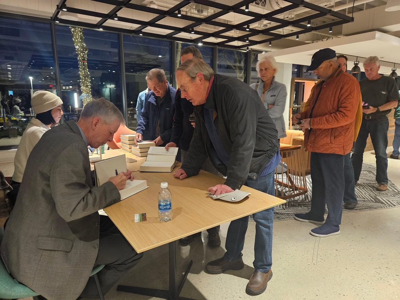 Kevin Weddle signing books for readers